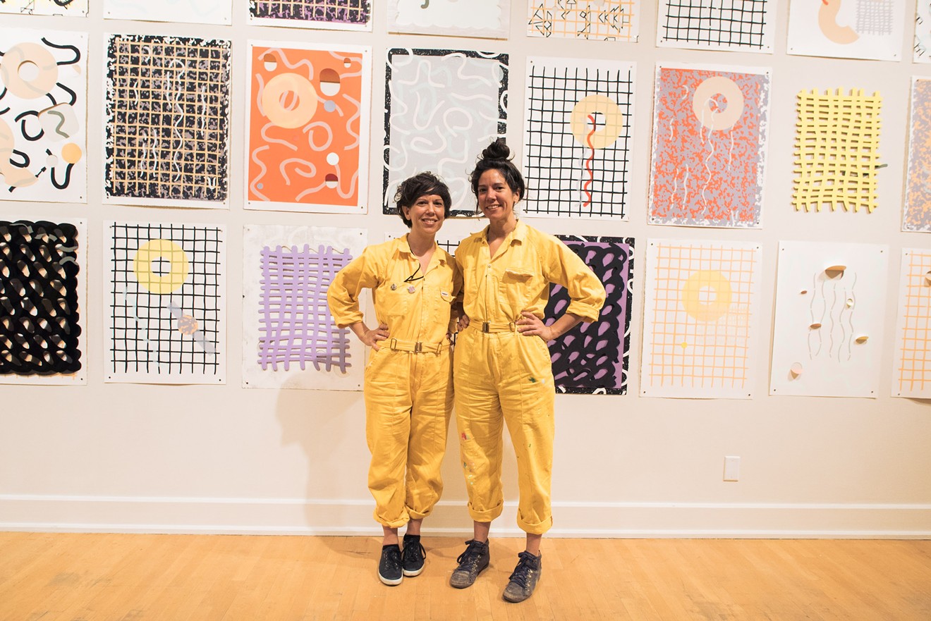 Las Hermanas Iglesias with prints featured in their "RE:SISTERS" exhibition at ASU Art Museum.