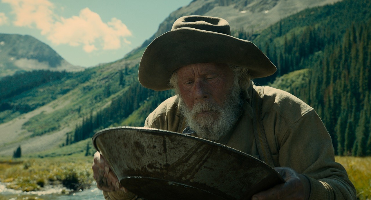 Tom Waits plays an old prospector who meticulously searches for a gold pocket near a pristine stream in The Ballad of Buster Scruggs, the Coens brothers’ new Western anthology film.