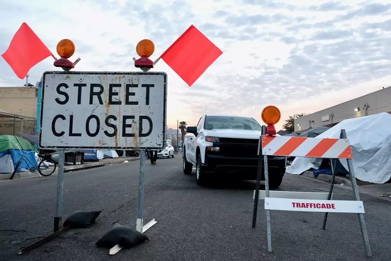Image: The city restarted controversial cleanups in the Zone on December 16 along a small strip of Madison Street.
