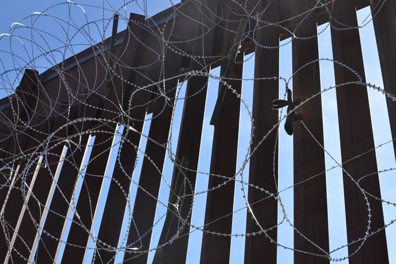 A tall border fence has long separated Nogales, Arizona, from Nogales, Mexico.