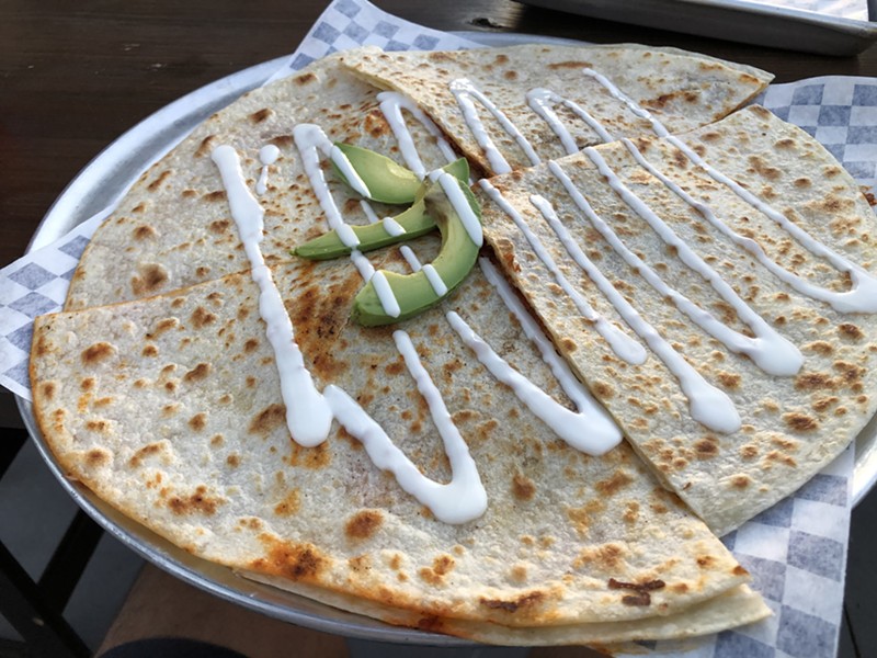 Our food critic has his expectations happily shattered by an unexpectedly large (and good) quesadilla.