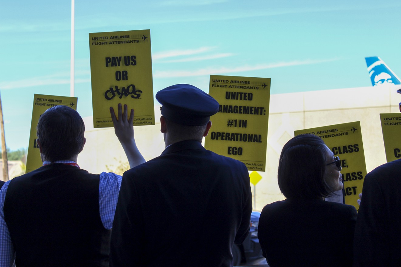 United flight attendants picketed at the Phoenix airport on Oct. 26 to demand better wages, something pilots at the airline received with a new contract in September.