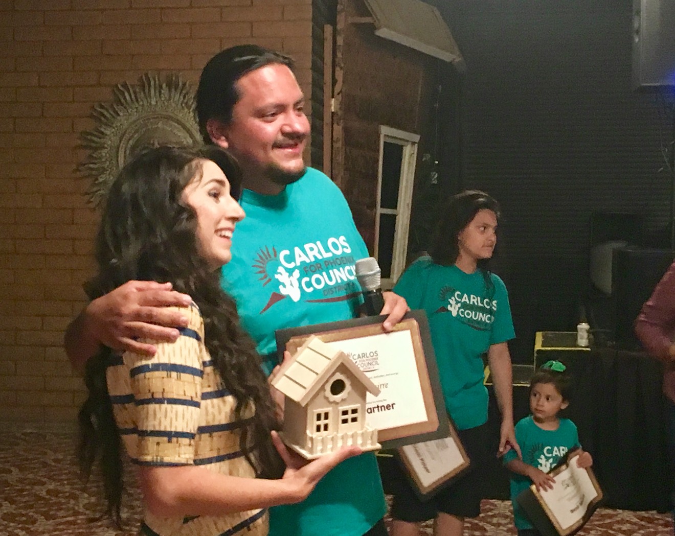 Carlos Garcia with his wife, Alexis, at his election night watch party on May 21, 2019.