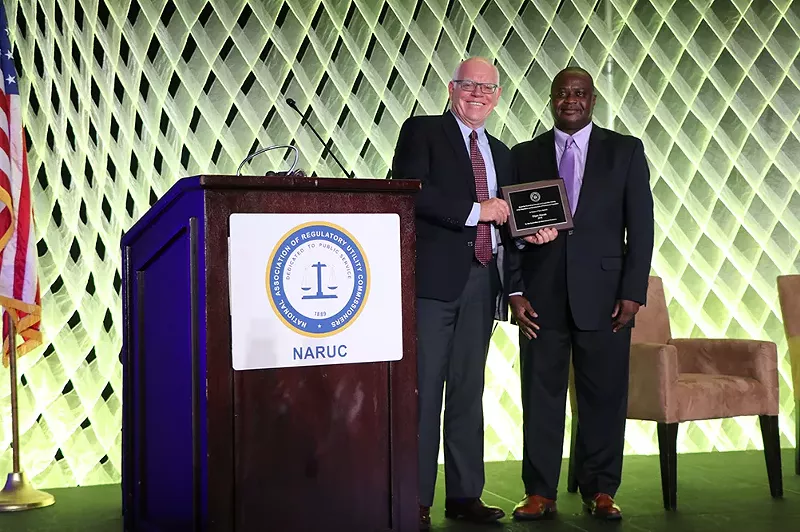Image: National Association of Regulatory Utility Commissioners (NARUC) honored Elijah Abinah with an award in November 2018 for "international cooperation among utility regulators and the development of professional regulation."