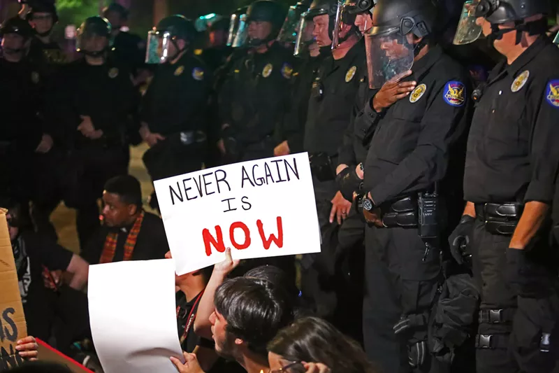 Image: Scene from Friday's Lights for Liberty protest.