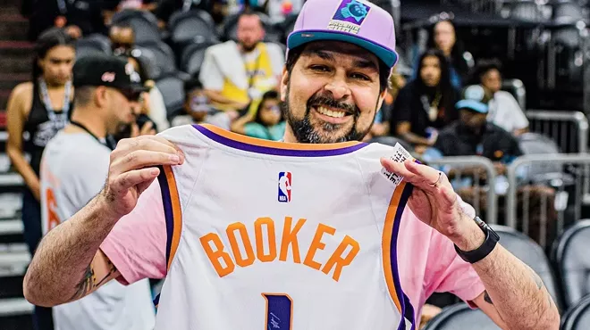 Henry Garcia with autographed Devin Booker jersey