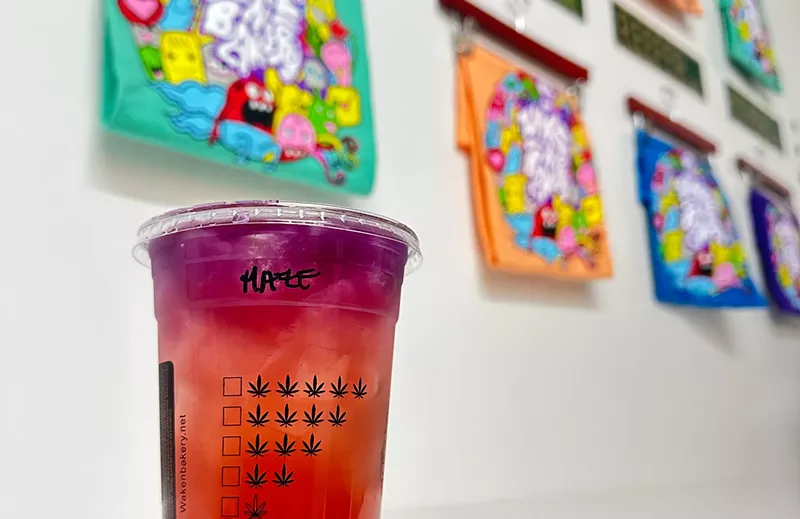 Image: a red and orange drink on a counter
