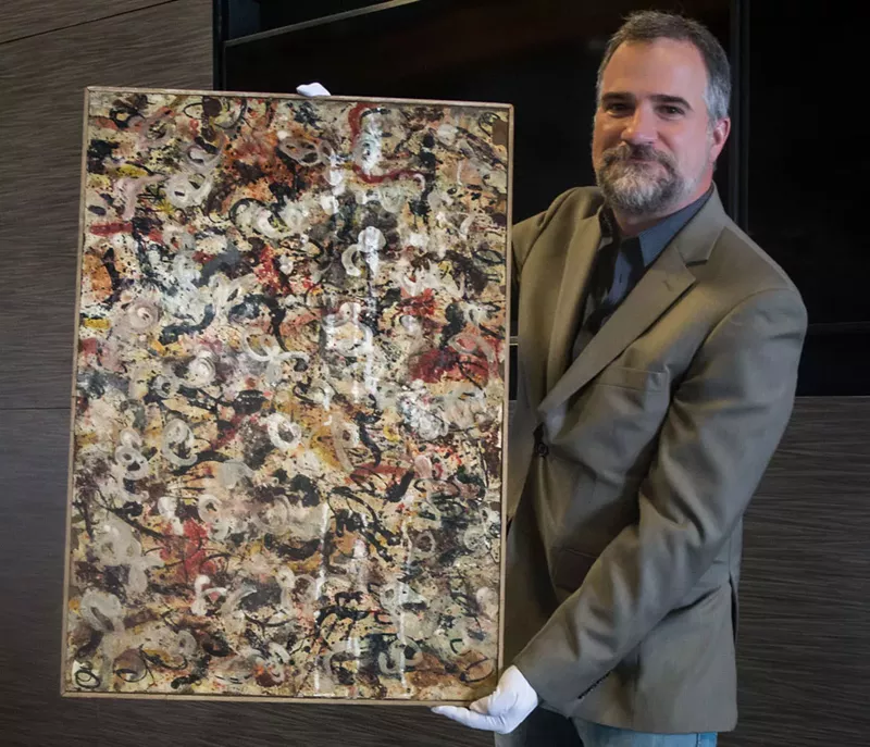 Image: Josh Levine, owner and CEO of J. Levine Auction & Appraisal, with a painting he attributes to Jackson Pollock.