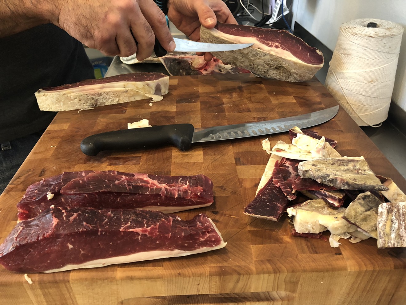 Trimming long-aged New York strip