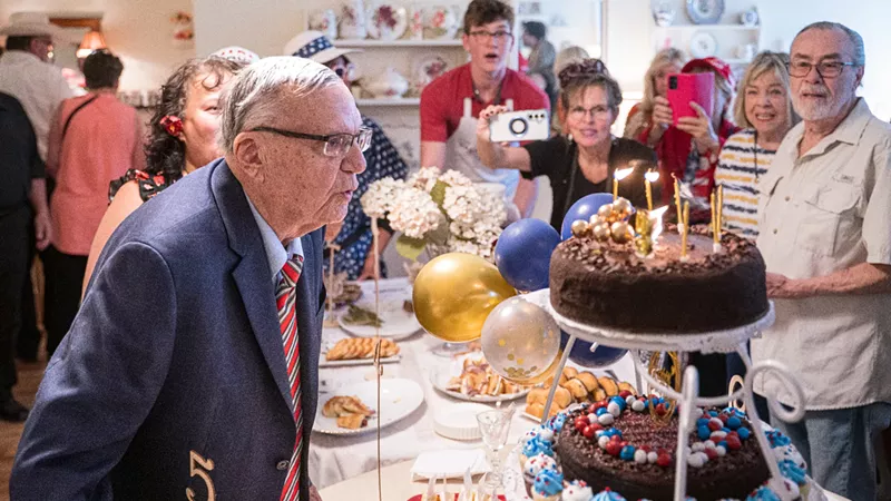 Image: joe arpaio blows out candles on a birthday cake