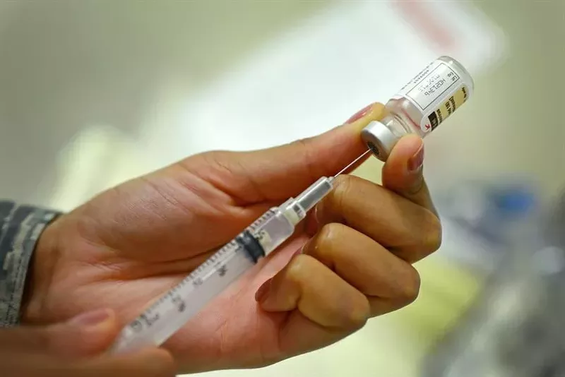 Image: Most people won't be able to get the new COVID-19 vaccines until spring or summer, according to local public health officials
