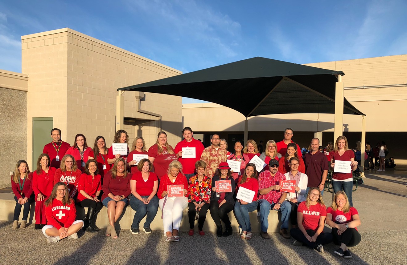 Staff at Desert Shadows Middle School in the Paradise Valley school district pose for a photo in the #RedForEd campaign on teacher pay.