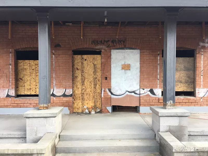 Image: Partial progress made on removing graffiti from the Wurth House.