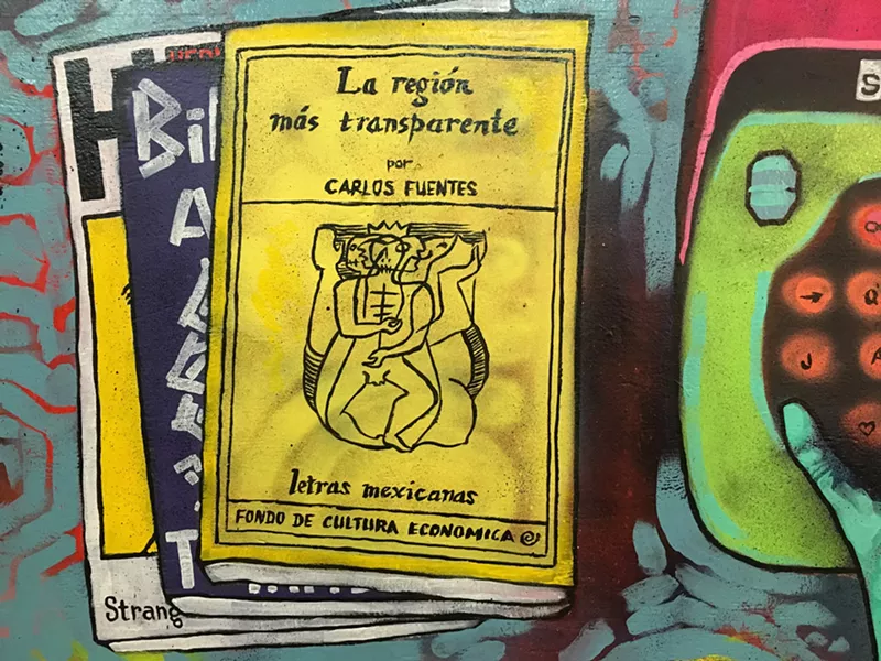 Image: Detail of the Jeff Slim mural that used to be inside the Palabras space on Grand Avenue.