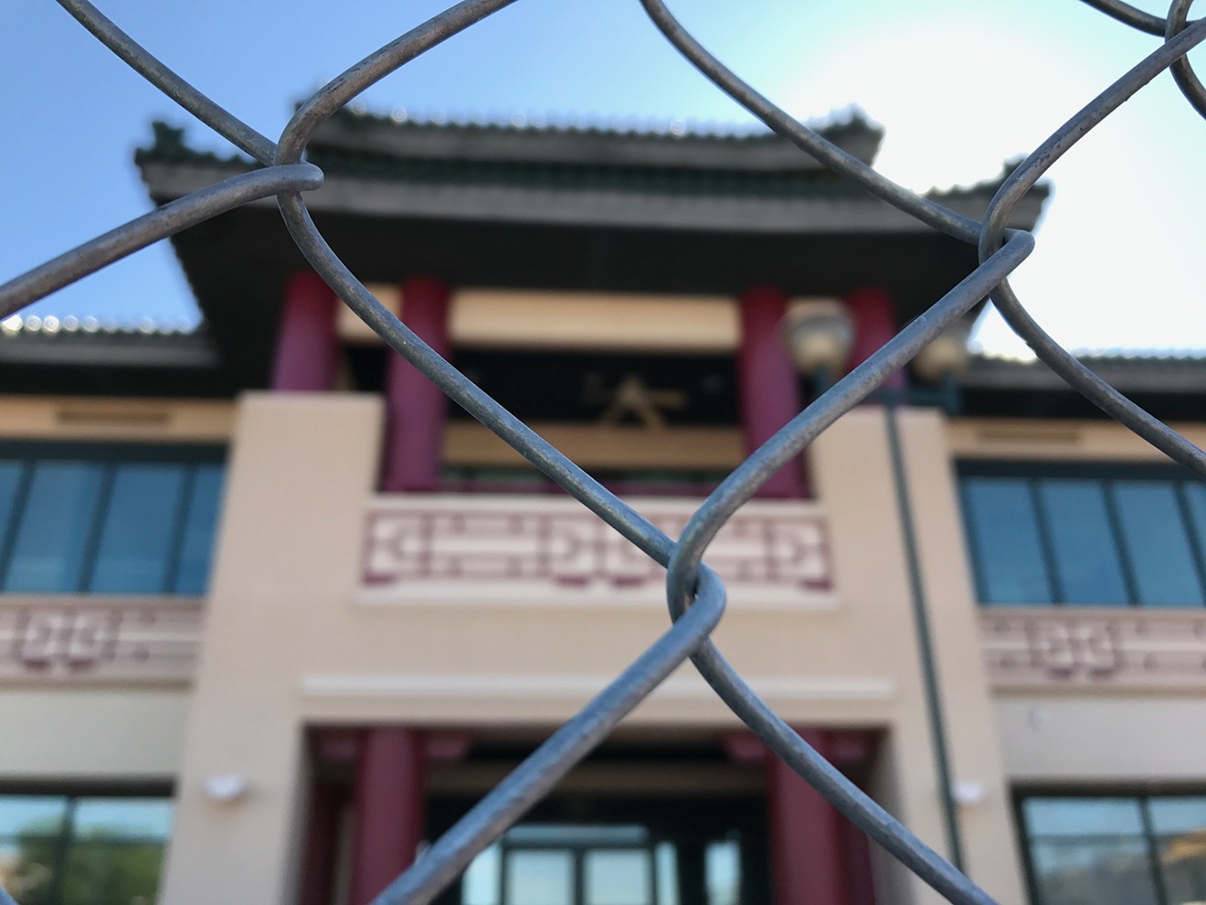 Fencing around part of the Chinese Cultural Center, before green mesh was added.