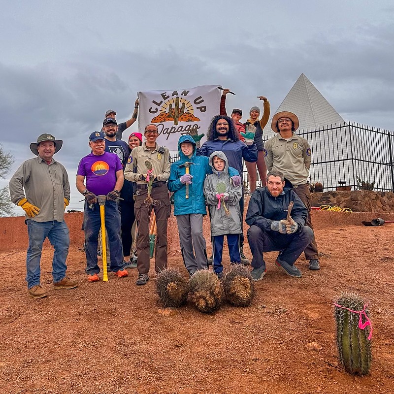 A group of volunteers helps clean up Papago Park.