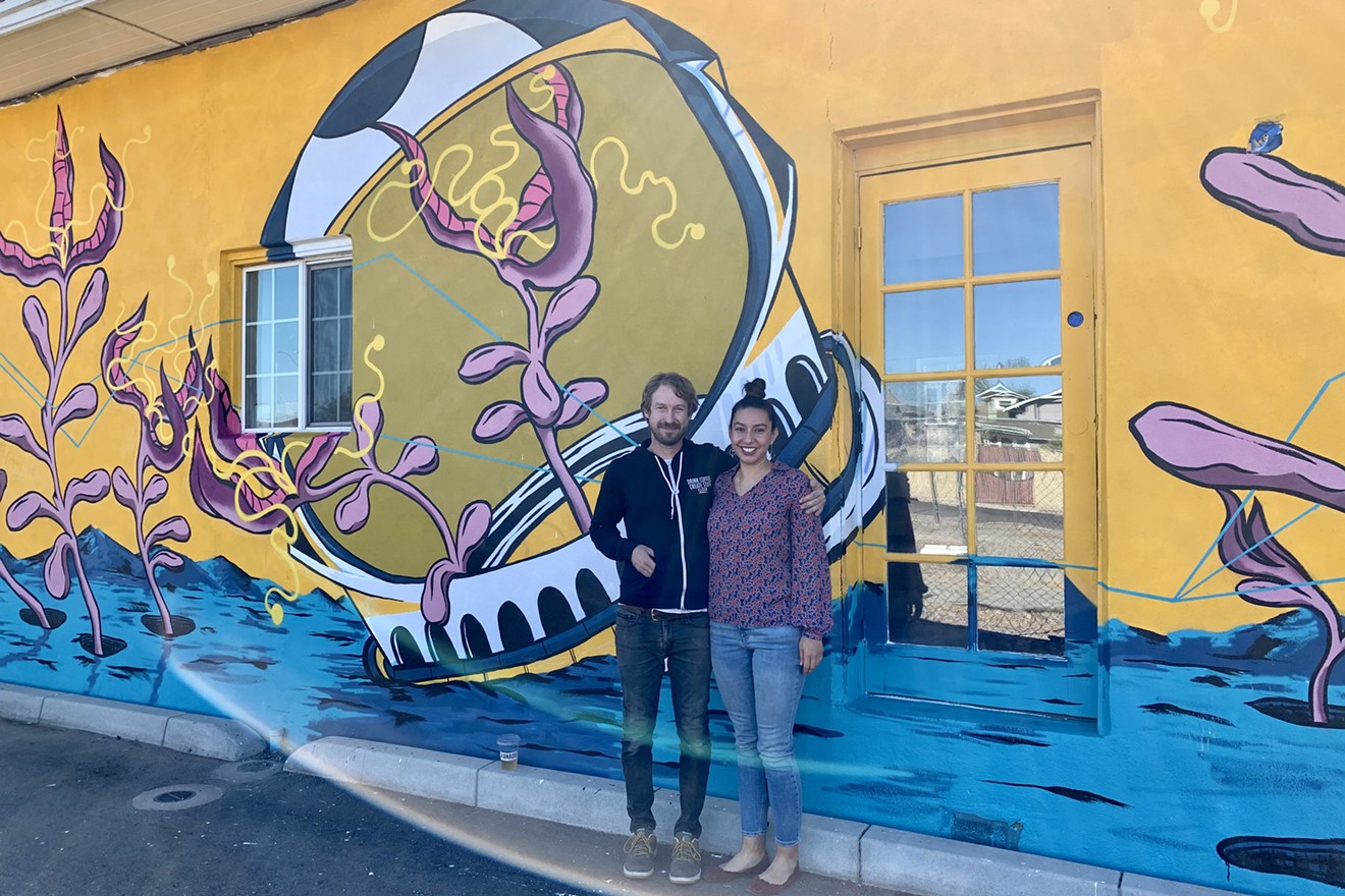 Xanadu Coffee Co. owners Randall Denton and Jessica Bueno (mural by Oscar Ruiz).