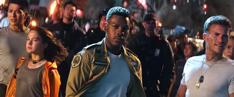 Image: The cast of Pacific Rim Uprising includes (from left): Cailee Spaeny as Amara, John Boyega as Jake, and Scott Eastwood as Nate.