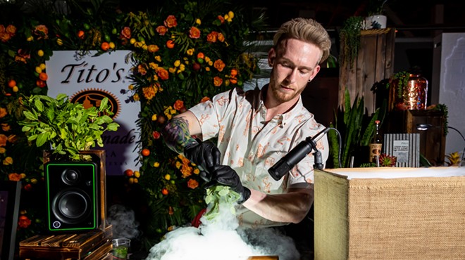 Man pouring a cocktail.