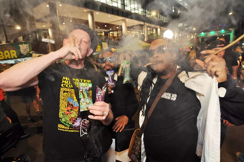 Image: two people smoke weed