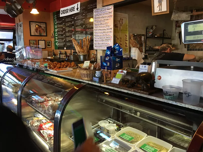 Image: Andreoli Italian Grocer's front counter, goods behind glass.