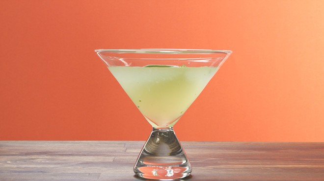 Martini glass with orange background.