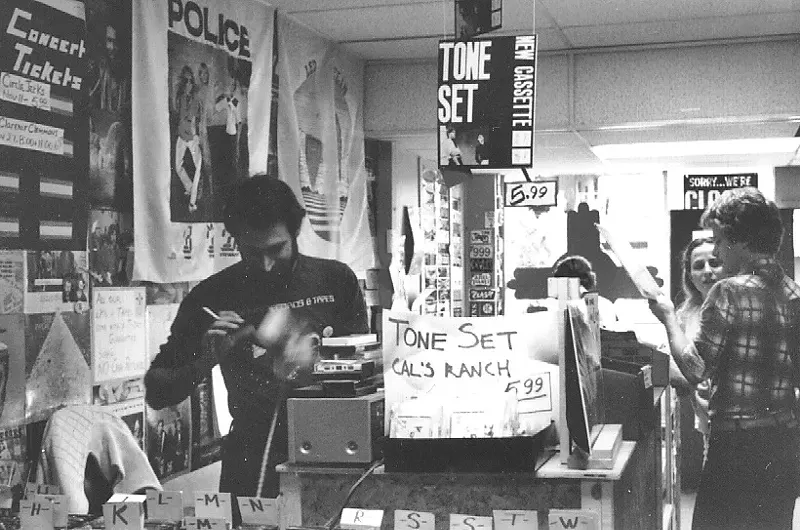 Image: Zia Records founder Brad Singer behind the counter at the chain's first store at Indian School Road and 19th Avenue in the early '80s.